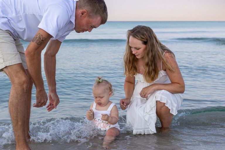 Golden hour portraits with orange outfits on the beach