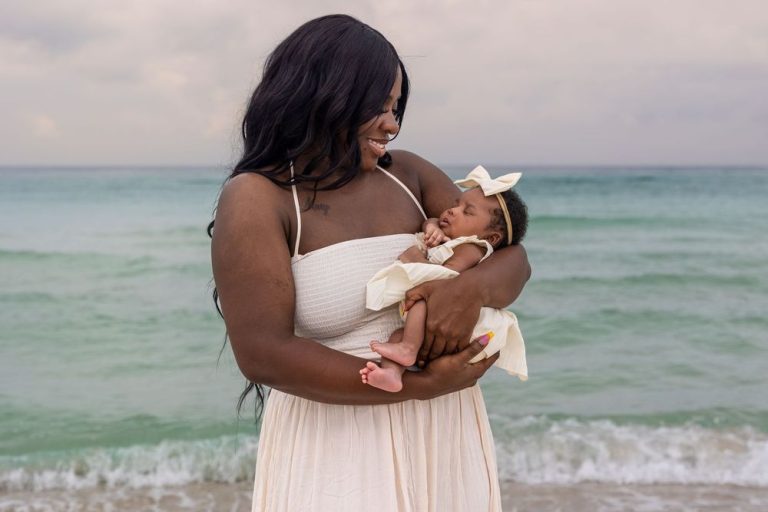Romantic beach portraits in white dress against turquoise ocean waves